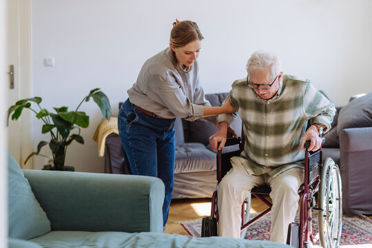 CareBee caregiver supporting an elderly person at home
