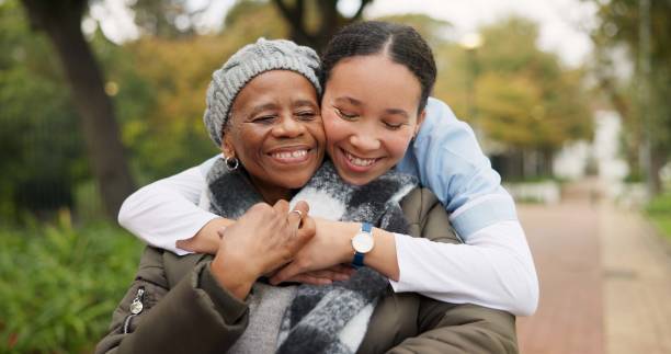 Home caregiver helping senior family member